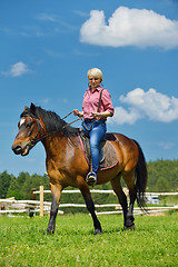 Image showing happy woman  ride  horse