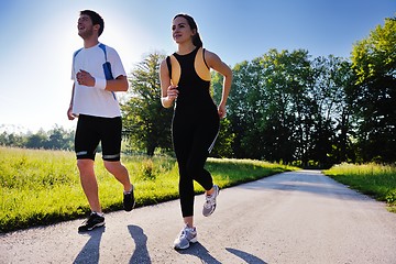 Image showing Young couple jogging