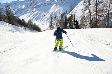 Image showing skiing on fresh snow at winter season at beautiful sunny day