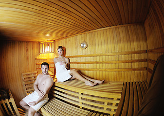 Image showing happy young couple in sauna