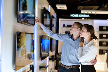 Image showing Young couple in consumer electronics store