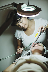 Image showing woman with facial mask in cosmetic studio