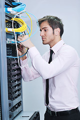 Image showing young it engeneer in datacenter server room