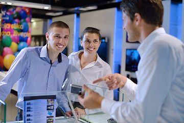 Image showing Young couple in consumer electronics store