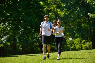 Image showing Young couple jogging