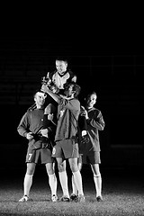 Image showing football players celebrating the victory