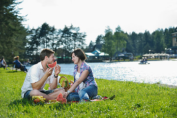 Image showing happy young couple having a picnic outdoor