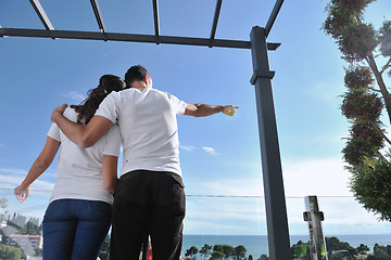 Image showing couple relaxing on balcony