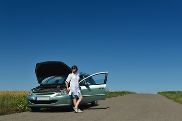 Image showing woman with broken car