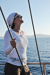 Image showing Greek woman on the streets of Oia, Santorini, Greece