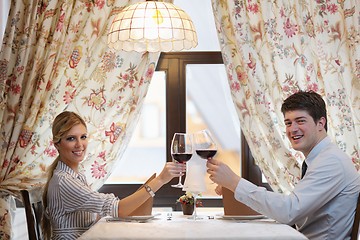 Image showing young couple having dinner at a restaurant