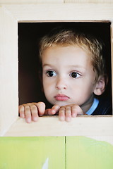 Image showing happy child in a window