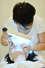 Image showing woman with facial mask in cosmetic studio