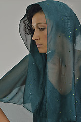 Image showing elegant woman in fashionable dress posing in the studio