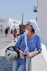 Image showing Greek woman on the streets of Oia, Santorini, Greece