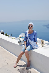 Image showing Greek woman on the streets of Oia, Santorini, Greece