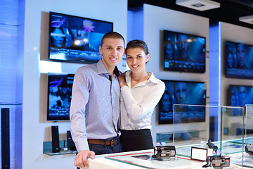 Image showing Young couple in consumer electronics store