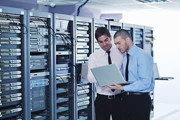 Image showing it enineers in network server room