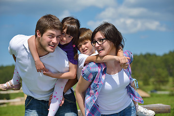 Image showing happy young family have fun outdoors