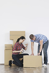 Image showing Young couple moving in new home