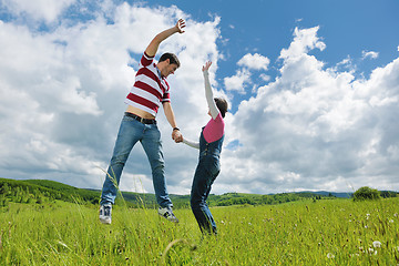 Image showing Portrait of romantic young couple smiling together outdoor