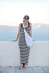 Image showing Greek woman on the streets of Oia, Santorini, Greece