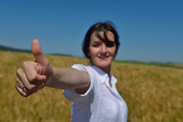 Image showing young woman in wheat field at summer