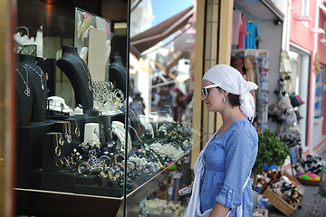 Image showing Greek woman on the streets of Oia, Santorini, Greece