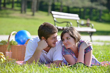 Image showing happy young couple having a picnic outdoor