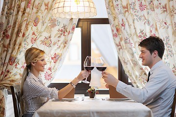 Image showing young couple having dinner at a restaurant