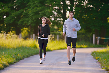 Image showing Young couple jogging