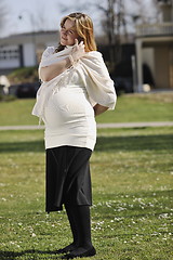 Image showing happy young pregnant woman outdoor