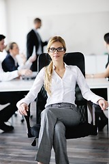 Image showing business woman with her staff in background