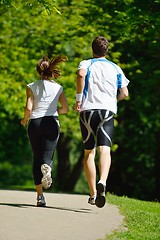 Image showing Young couple jogging