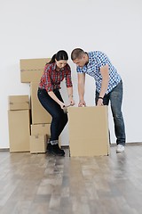 Image showing Young couple moving in new house