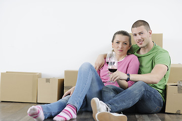 Image showing Young couple moving in new home