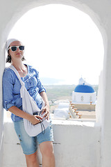 Image showing Greek woman on the streets of Oia, Santorini, Greece