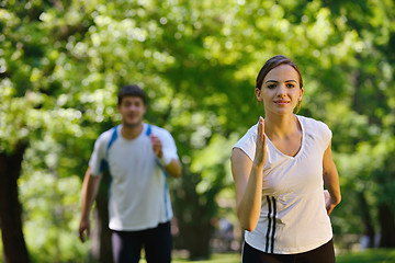 Image showing Young couple jogging