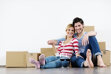 Image showing Young couple moving in new house