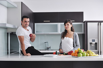 Image showing young couple have fun in modern kitchen