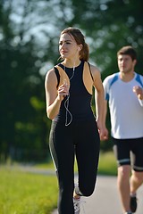 Image showing Young couple jogging at morning