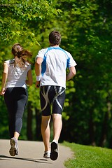 Image showing Young couple jogging