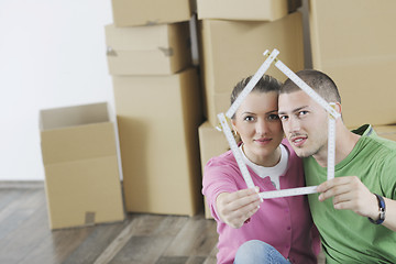 Image showing Young couple moving in new home