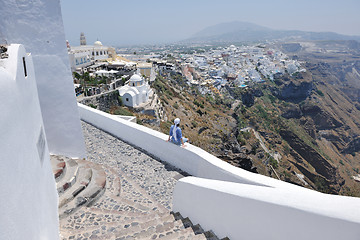 Image showing Greek woman on the streets of Oia, Santorini, Greece