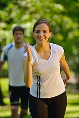 Image showing Young couple jogging