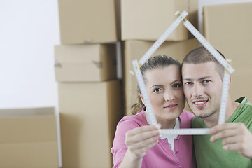 Image showing Young couple moving in new home