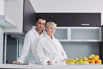 Image showing young couple have fun in modern kitchen