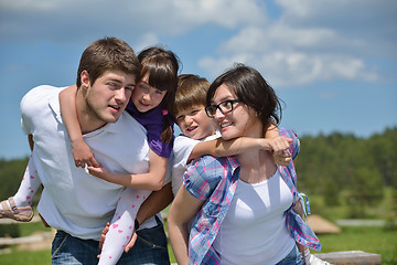 Image showing happy young family have fun outdoors