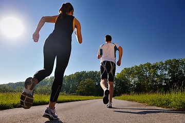 Image showing Young couple jogging