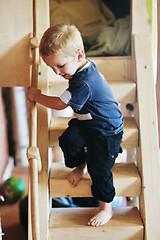 Image showing beautiful young child making first steps